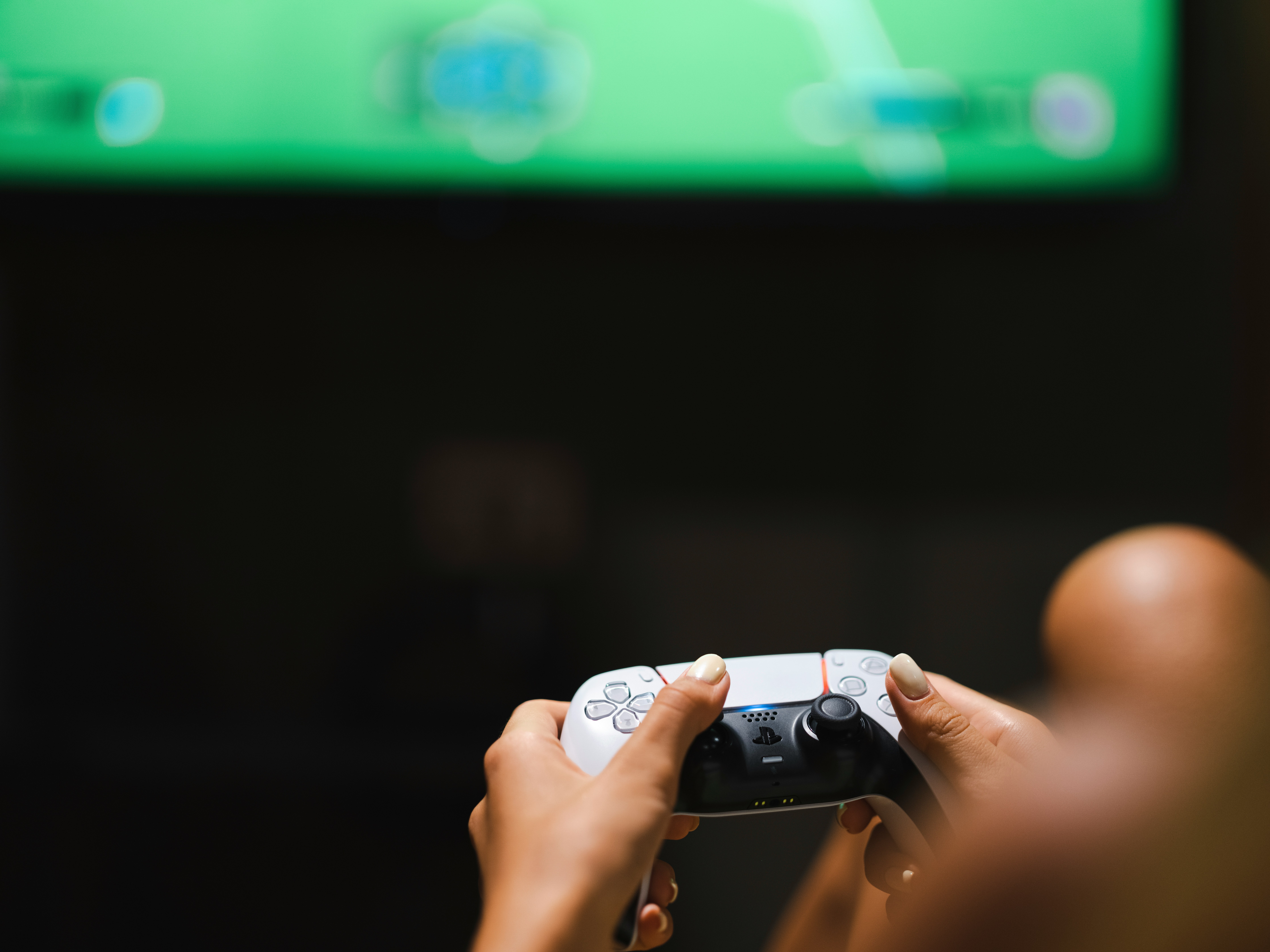 PlayStation DualSense controller in a living room