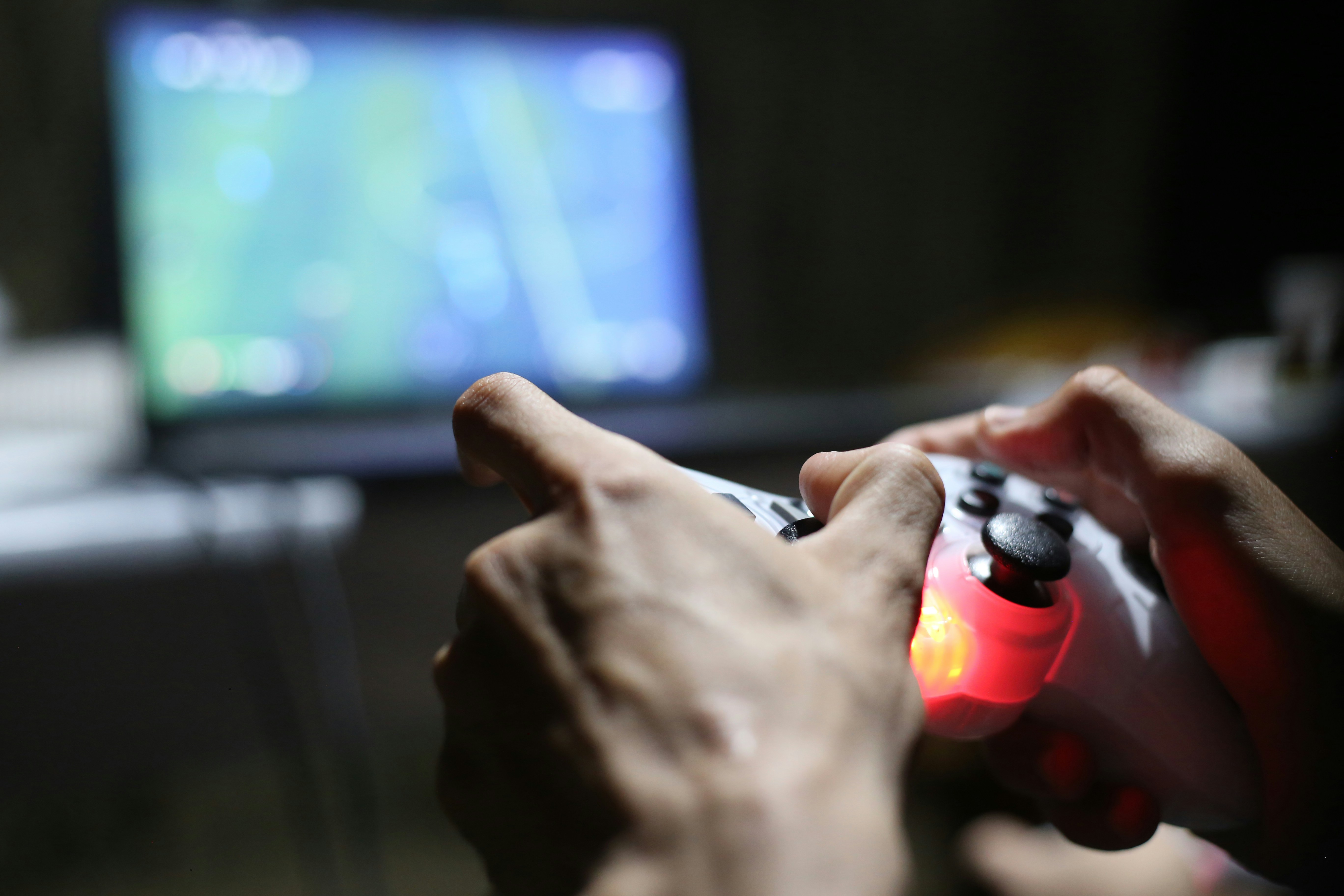Hands on a DualSense controller during play